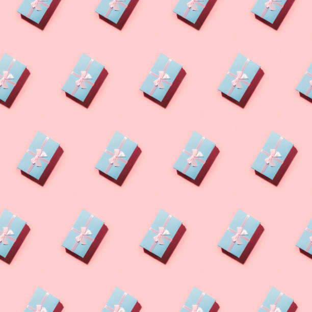istock Open composition of many blue pastel gift boxes on pink in diagonal. 1174837773