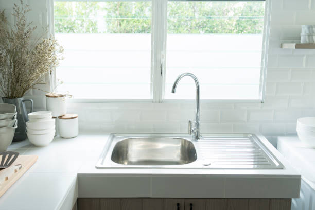 istock a kitchen sink near the window. 1174838756