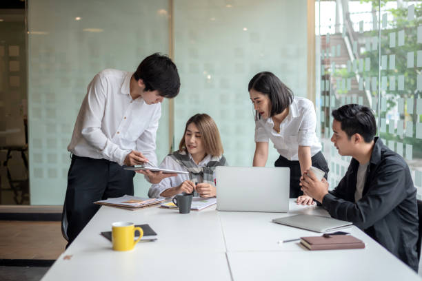istock Young asian business group with the creative work, talk and exchange ideas shared at the meeting. 1174841396