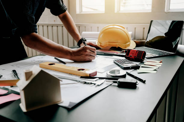 istock Architect with creativity for designing projects and drawing on blueprint on the office. 1174841410