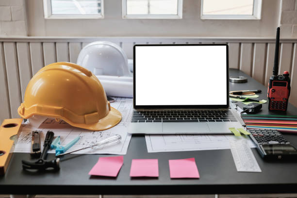 Laptop with blank screen on the engineer desk. stock photo