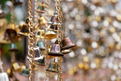 old small bells hanging with small bell blurred background