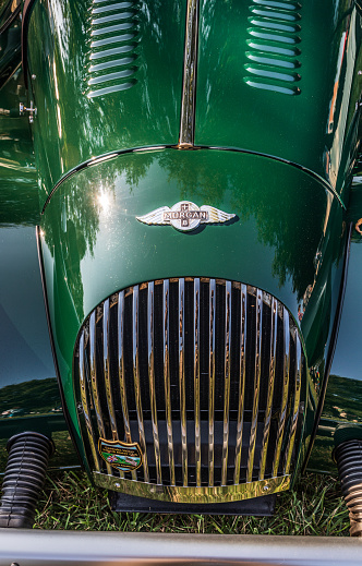 Hickory, NC, USA-7 Sept 2019: 1985 Morgan plus 8, convertible sports car, British Racing Green.  Front (grille) view from above.