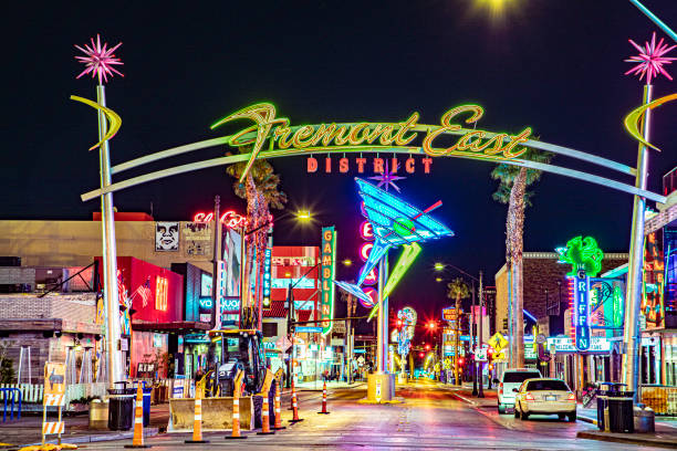 remont east district neon sign and traffic in Las Vegas downtown night shot Las Vegas, Nevada - March 11, 2019: Fremont east district neon sign and traffic in Las Vegas downtown night shot remont stock pictures, royalty-free photos & images