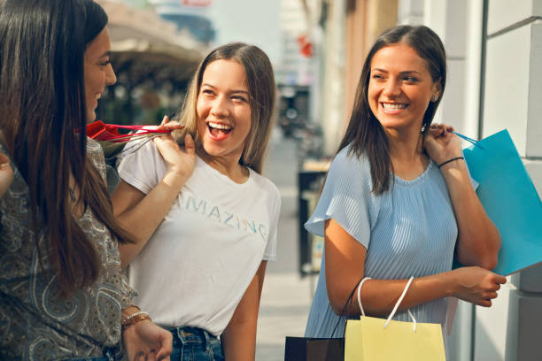 istock Happy women going home from shopping 1174844143