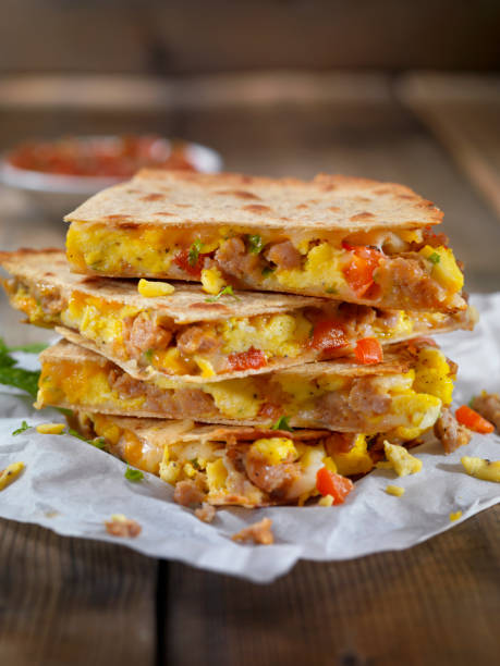 istock Cheesy Breakfast Quesadilla with Sausage, Scrambled Eggs and Peppers 1174846384