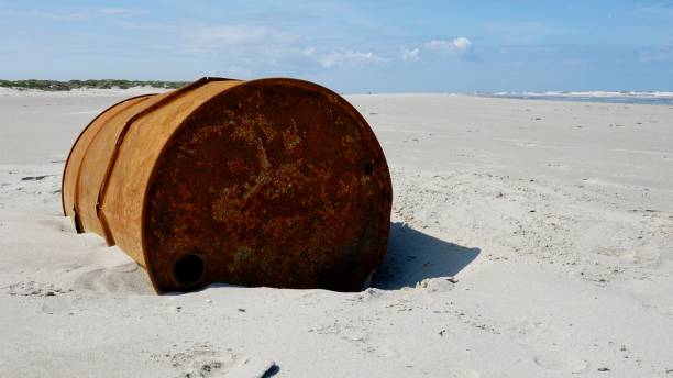 istock Metal barrel at a beach 1174848528