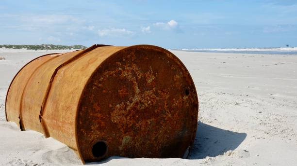 istock Metal barrel at a beach 1174848626