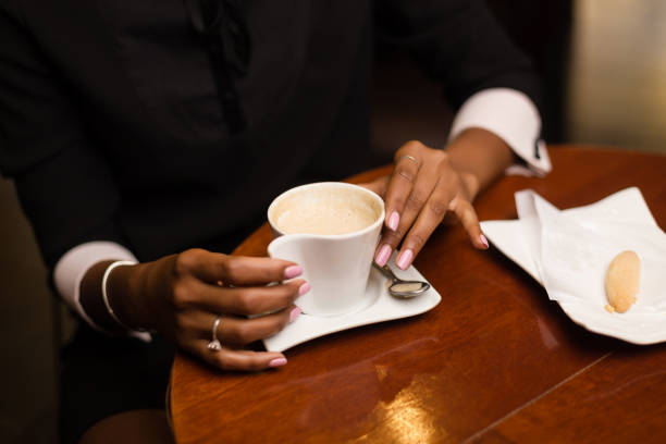 istock Black African American young gxpress drinking coffee 1174853164
