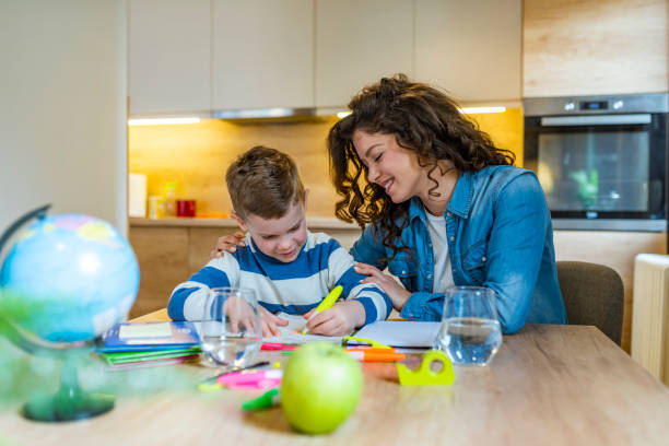 istock The tutor is engaged with the child 1174853584
