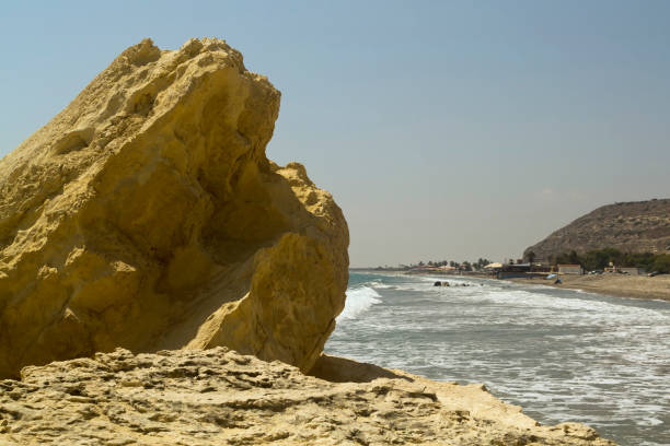 istock Yellow rock in front of sky and sea 1174856049