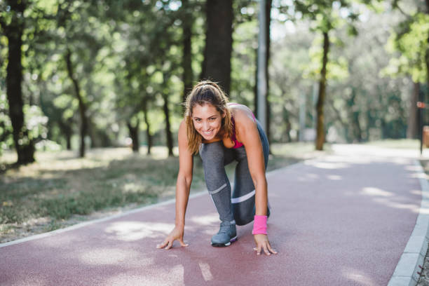 istock Young woman athlete jogging 1174856058
