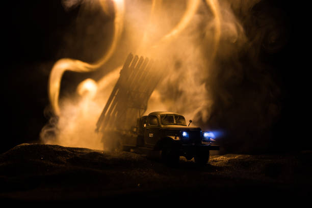 istock Rocket launch with fire clouds. Battle scene with rocket Missiles with Warhead Aimed at Gloomy Sky at night. Soviet rocket launcher on War Background. 1174856117
