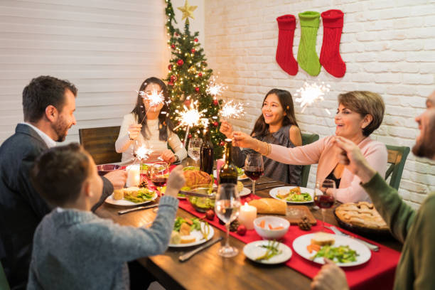 istock Family Lighting Sparklers While Having Meal At Home 1174857230