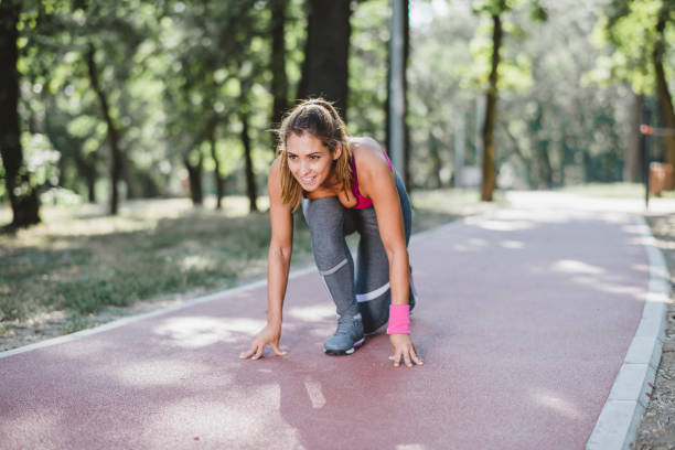 istock Young woman athlete jogging 1174857243
