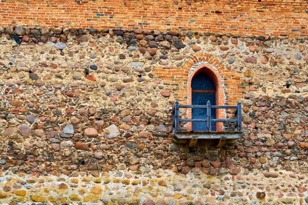 lattice in the old wall from red brick