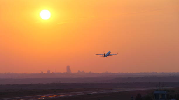 istock aircraft departure sunset 1174858199