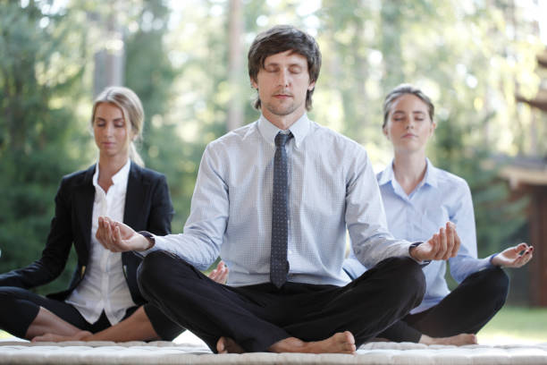 istock Business people practicing yoga 1174858504