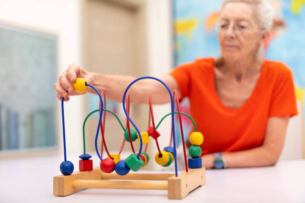 istock Old Woman make exercise why she is protected Alzheimer's disease 1174858815