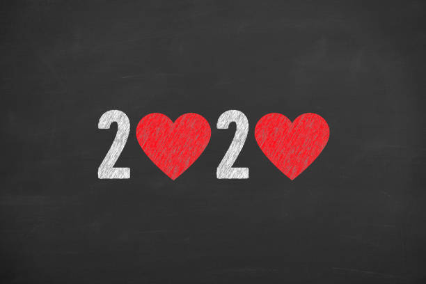 istock New Year 2020 with Heart Shape on Blackboard Background 1174864797