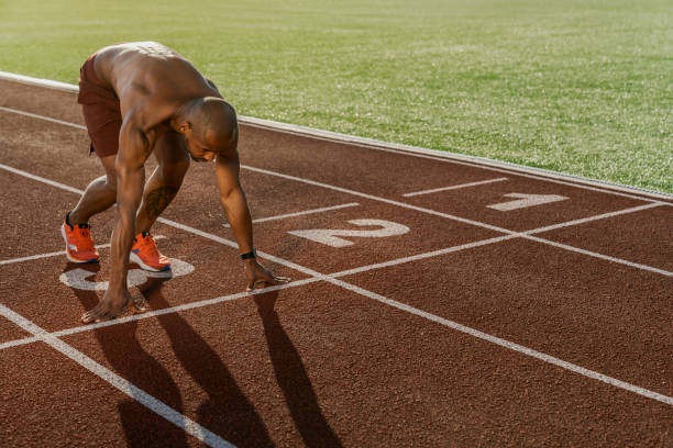 istock Sprinter starting on the running track. Sport background 1174864878