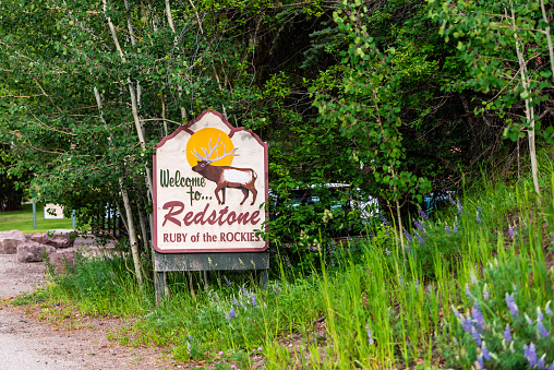 Redstone, USA - July 1, 2019: Highway 133 in Colorado during summer with welcome sign for town ruby of the rockies