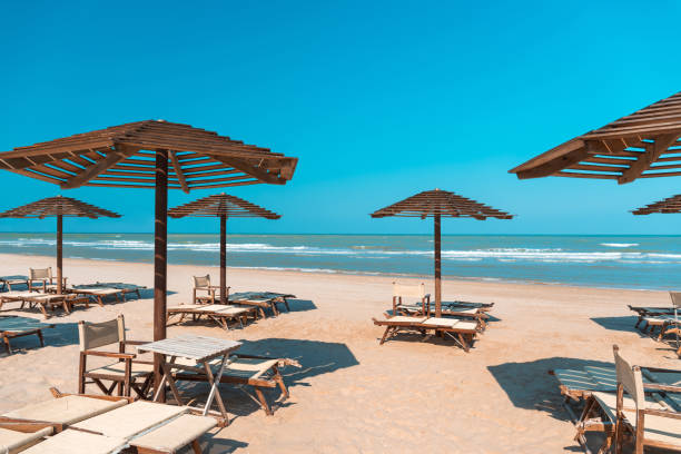 istock Beach in late summer, deck chairs and parasols 1174865992