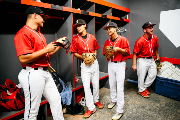 istock Hispanic baseball team relaxing in locker room before game 1174867066