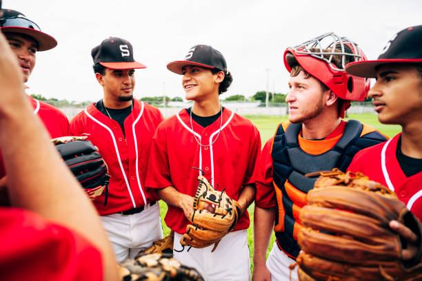 istock Hispanic baseball team standing together and ready to play 1174867082