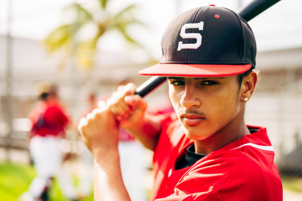istock Serious young Hispanic baseball player in batting stance 1174867112