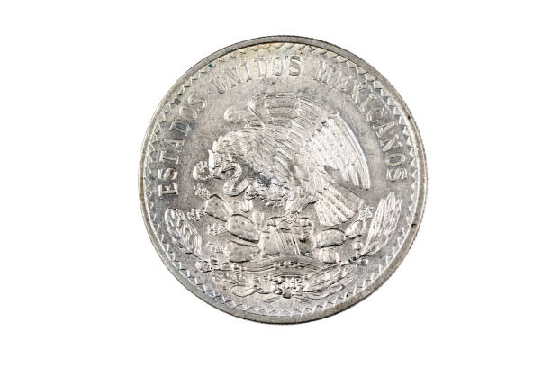 istock 1947 Silver Mexican Peso isolated on a white background 1174867606