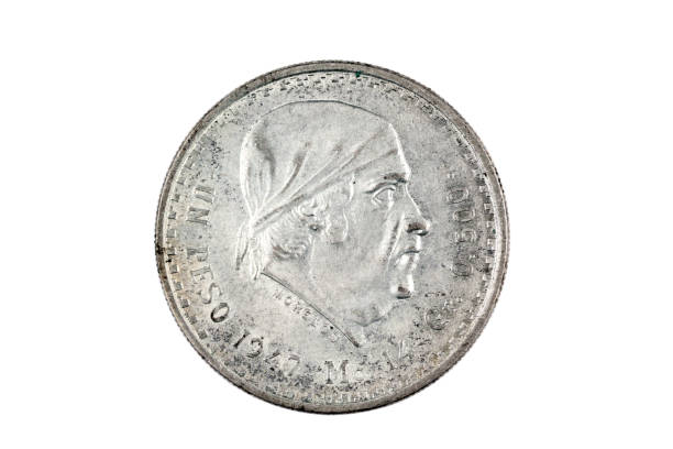 istock 1947 Silver Mexican Peso isolated on a white background 1174867619