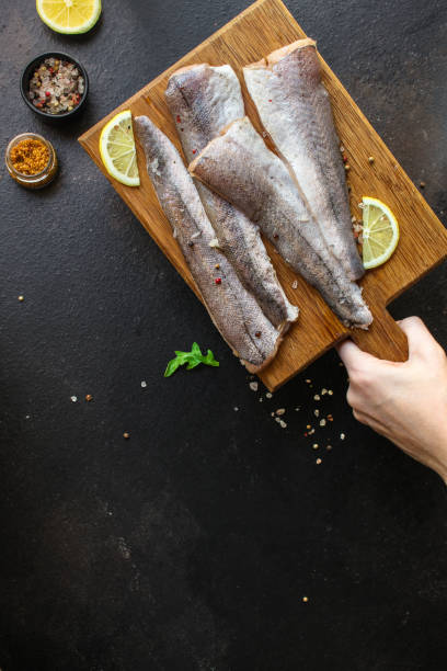 istock fish raw hake (set of ingredients for cooking). food background. top view. copy space 1174868539