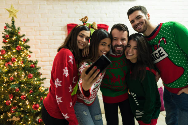 istock Friends Making Memories While Enjoying Christmas At Home 1174870080