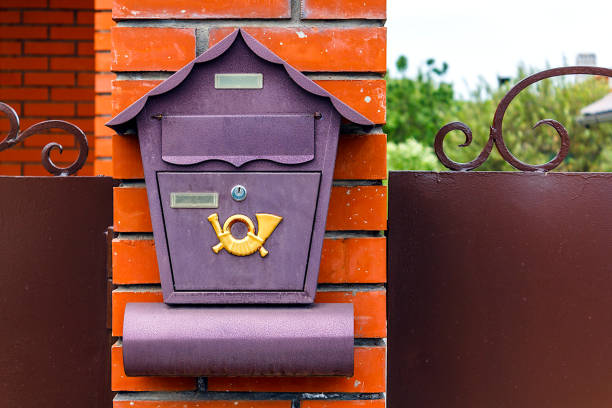istock A beautiful mailbox hangs waiting for newspapers, parcels and letters. 1174872690