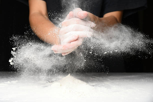 istock Clap hands of baker with flour 1174872900