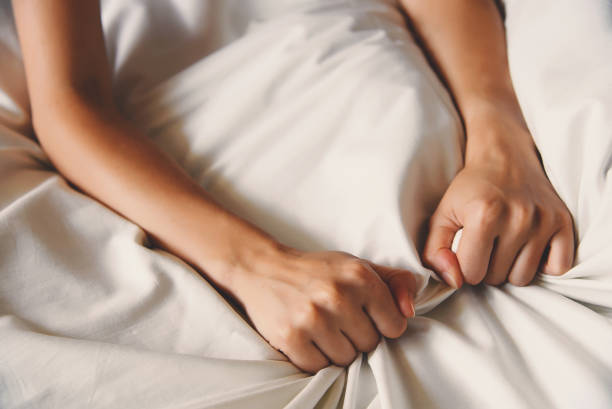 istock Woman hand sign orgasm on bed 1174872913