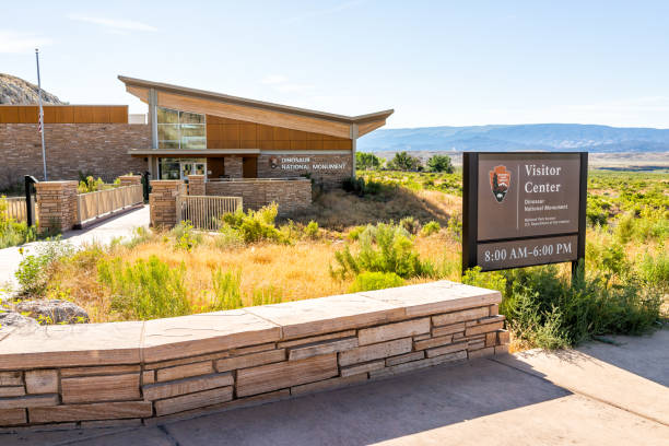 Quarry visitor center exterior in Dinosaur National Monument Park outside with sign to entrance in Utah Jensen, USA - July 23, 2019: Quarry visitor center exterior in Dinosaur National Monument Park outside with sign to entrance in Utah vernal utah stock pictures, royalty-free photos & images