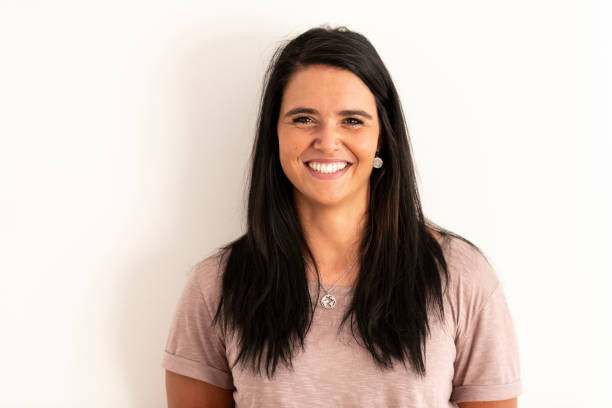 istock Smiling young woman looking at camera 1174874296