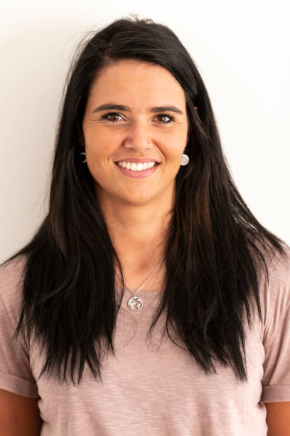 istock Smiling young woman looking at camera 1174874309