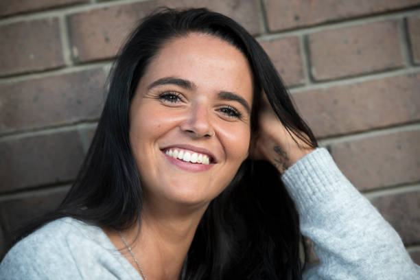 istock Happy young woman portrait 1174874363