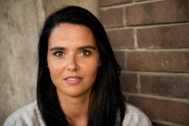istock Serious young woman portrait 1174874367