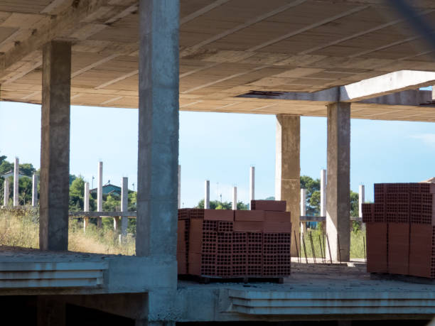 istock Abandoned unfinished building, Destroyed  brick structures of unfinished building 1174879375
