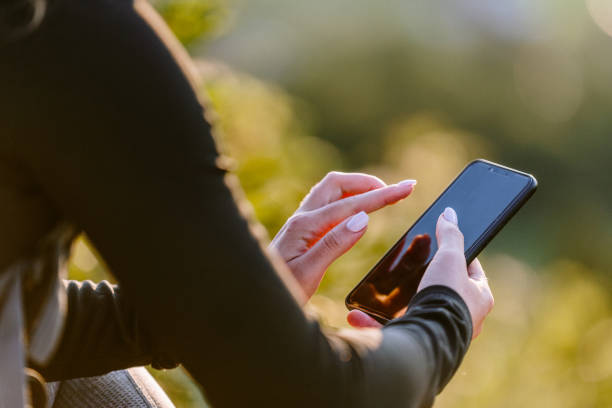istock Sporty woman using phone 1174880955