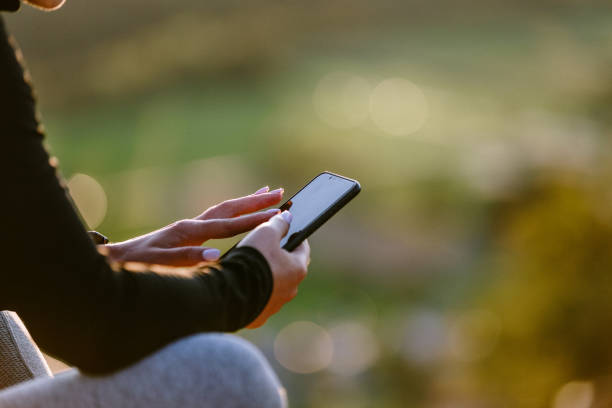 istock Sporty woman using phone 1174882661