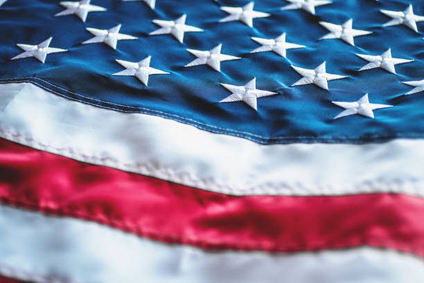 istock American or USA flag background, selective focus, close up 1174882970