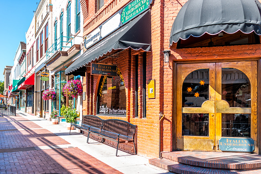 Glenwood Springs, USA - July 10, 2019: Historic street sidewalk in Colorado on Grand Avenue and Italian restaurant