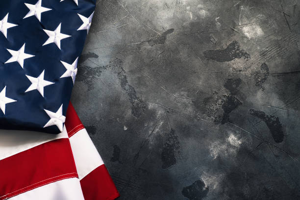 istock American or USA flag on concrete background with copy space for text, top view 1174884245