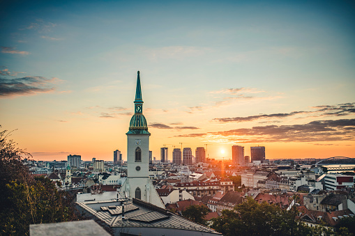 View of Bratislava City, Slovakia with St. Martin Cathedral in Focus at Sunrise