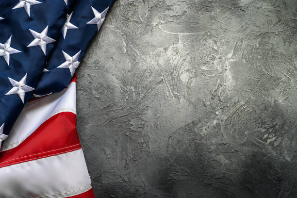 istock American or USA flag on concrete background with copy space for text, top view 1174884925